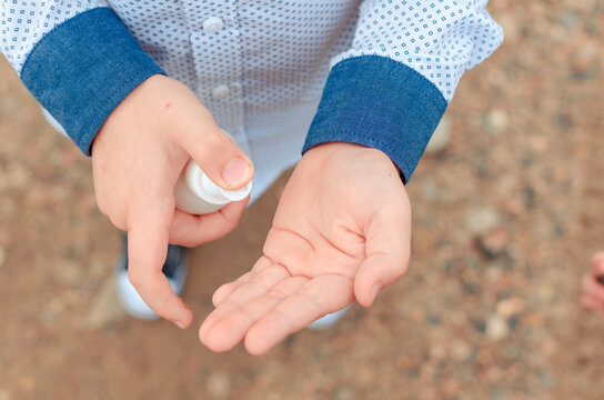 disinfection of the child's hands sanitizer alcohol gel for killing the viruses. back to school. Antiseptic spray. Prevention of coronavirus COVID-19 Cleaning Hands. Education