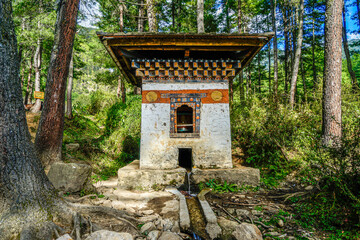 Bhutan, near the city of Paro,  a small temple and watermill