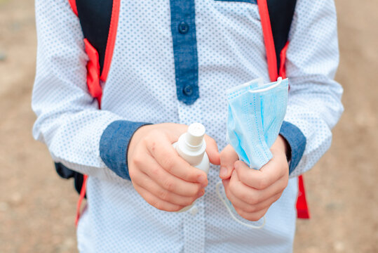 disinfection of the child's hands sanitizer alcohol gel for killing the viruses. back to school. Antiseptic spray. Prevention of coronavirus COVID-19 Cleaning Hands. Education - Powered by Adobe