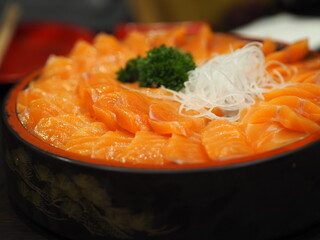 Slice Fresh salmon fish arranged in a wooden tray style Japanese food
