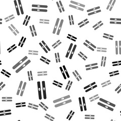 Black Ski and sticks icon isolated seamless pattern on white background. Extreme sport. Skiing equipment. Winter sports icon. Vector Illustration.