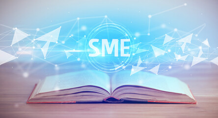 Open book with SME abbreviation, modern technology concept