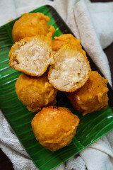 Fried getuk ubi is Malaysian snack food made from tapioca. Fried and served on a banana leaf.