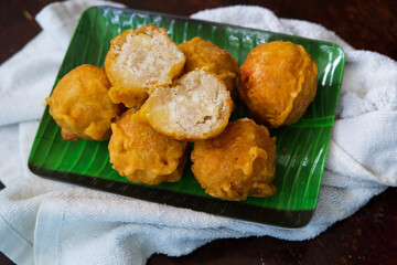 Fried getuk ubi is Malaysian snack food made from tapioca. Fried and served on a banana leaf.