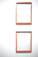 four picture frames hung on a white wall
