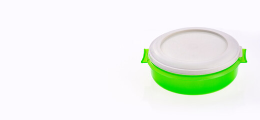 Plastic food bowl with green lid - Text space
