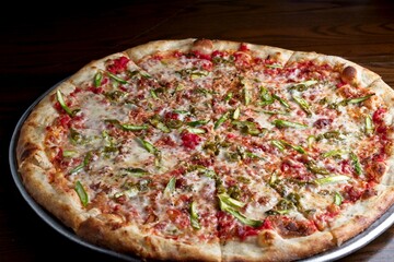 Gourmet pizza with asparagus, bacon & jalapeño