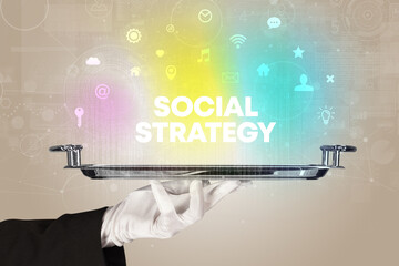 Waiter serving social networking with SOCIAL STRATEGY inscription, new media concept