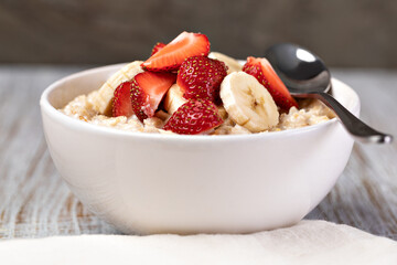 prepared oatmeal with fruits and berries