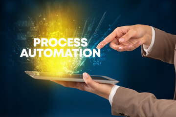 Close-up of a touchscreen with PROCESS AUTOMATION inscription, innovative technology concept