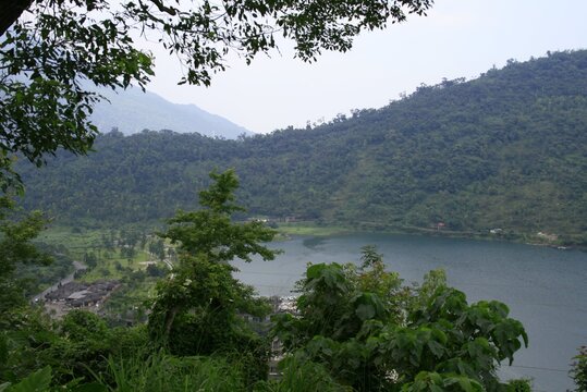 Beautiful view of the mountain with green trees and the water lack © Prakash