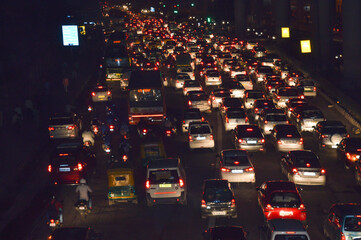 A view of traffic jam at night from the rooftop of bridge.