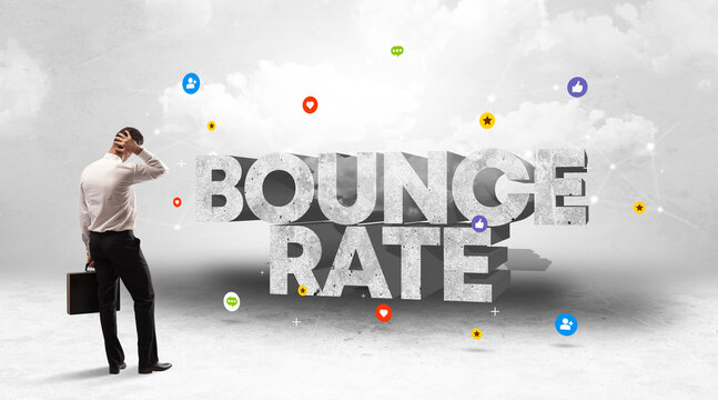 Young businessman standing in front of BOUNCE RATE inscription, social media concept