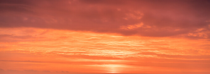 Romantic sunrise at a cloudy sky