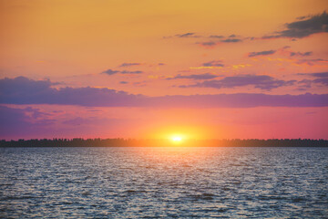 Colorful cloudy sky at sunset. Sunset over the sea. Gradient color. Sky texture. Abstract nature background