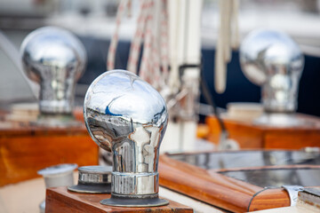 shiny dorade vents with varnished wood boxes on an elegant sailboat
