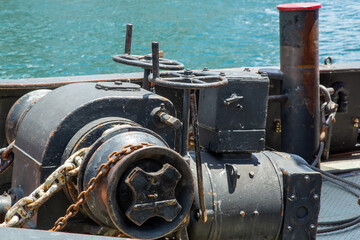 the chain winch and towing bitts of a tugboat