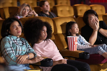 Happy family watching movie in cinema theatre. Happy family time in holiday