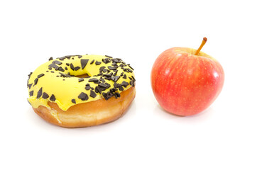 choice between apple or junk food, donut. Diet and healthy food concept. Vegetarian, vegan, raw concepts. Apple and donut isolated on white background.