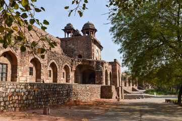 Fototapeta premium A mesmerizing view of architecture of small tomb at old fort from side lawn.