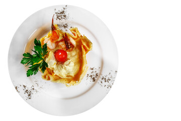 Dish of mussels, shrimp, flavored with lemon, tomatoes, lettuce, herbs. Top view.