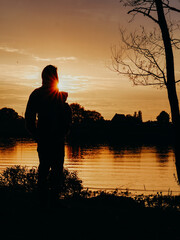 Fototapeta premium silhouette of a person in the sunset