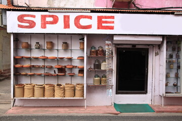View of Indian spices and herbs in pottery displayed on the wall at Jew town, Kochi, Kerala, India
