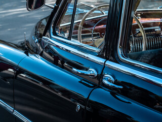 Steering wheel of an old classic car.
Interior of a vintage car.
Color image of the dashboard of a...