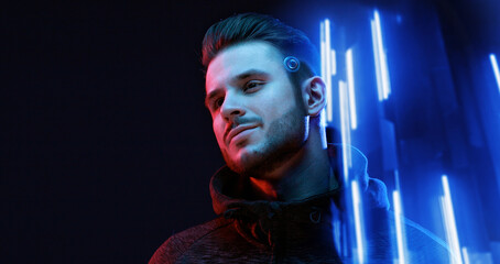 Young man with beard. Portrait of guy on dark backgound. Augmented reality, future technology...