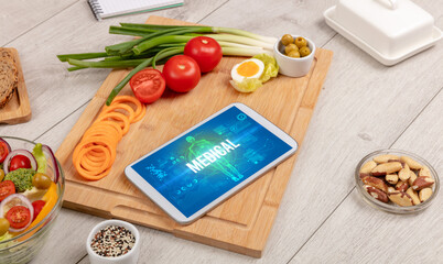 MEDICAL concept in tablet with fruits, top view