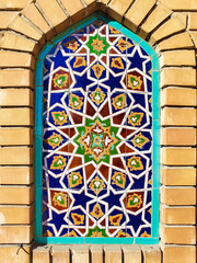 traditional Uzbek pattern on the ceramic tile on the wall of the mosque, background	