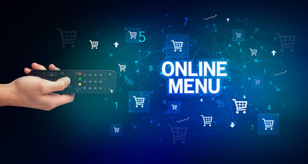 hand holding wireless peripheral with ONLINE MENU inscription, online shopping concept