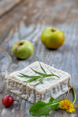 A block of Pont-l eveque French Normandy cheese resting on wooden board