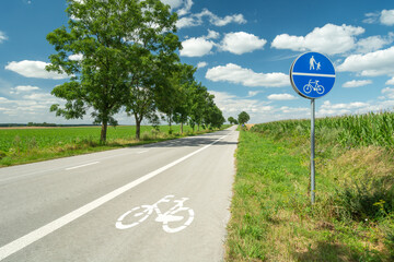Bike lane next to the highway and information sign