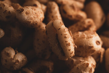 Macro close up of inflated wheat cereal, selective focus