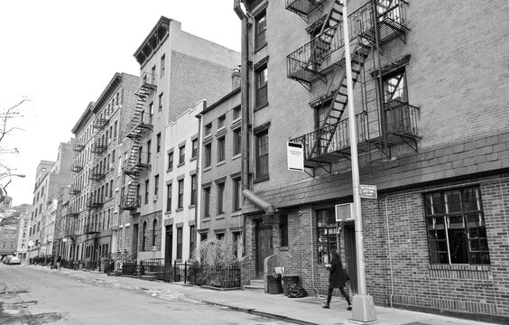 Urban Decay In Brick Building Facades With Fire Escapes On Run Down Street Or Backstreet In Downtown Manhattan New York Suburb Or Residential District Neighborhood