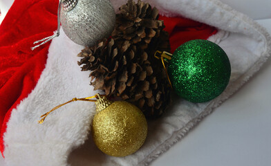 Red gift wrap, santa claus hat and decorations for the new year. Merry Christmas. 2021