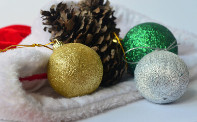 Red gift wrap, santa claus hat and decorations for the new year. Merry Christmas. 2021
