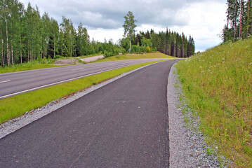 Fototapeta na wymiar Road and bike path in Finland