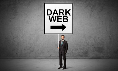 business person holding a traffic sign with DARK WEB inscription, new idea concept