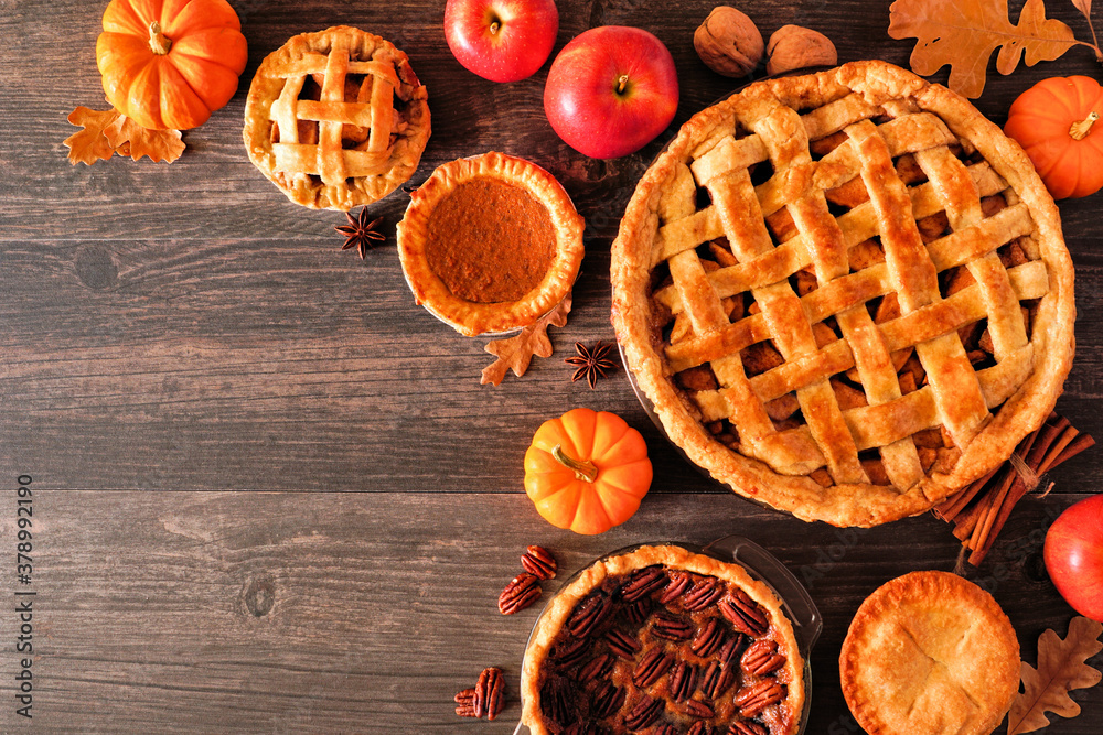Poster assorted homemade autumn pies. apple, pumpkin and pecan. above view corner border on a rustic wood b
