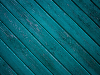 The bright blue texture of the wooden wall of planks