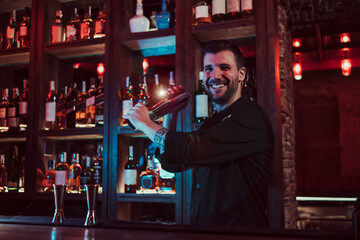 Bartender mixing cocktail in pub