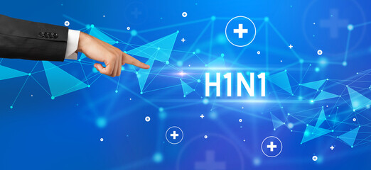 Close-Up of cropped hand pointing at H1N1 inscription, medical concept