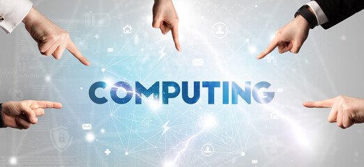 Hand pointing at COMPUTING inscription, modern technology concept
