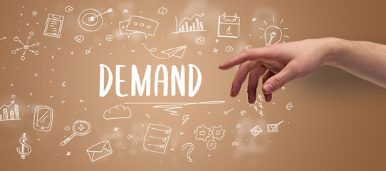 Close-Up of cropped hand pointing at DEMAND inscription, modern business solution concept