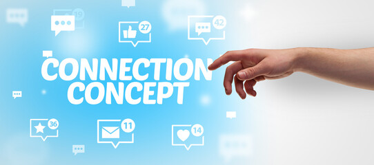 Close-Up of cropped hand pointing at CONNECTION CONCEPT inscription, social networking concept