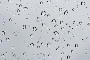 Water droplets on the glass in the rain. Water rain drop on window glasses