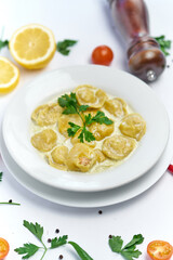 Italian ravioli pasta with meat or fish on white background
