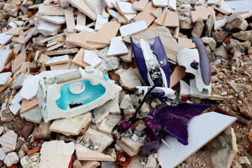 Broken irons at a construction waste dump. Spare parts from broken irons. Large dump of old and...